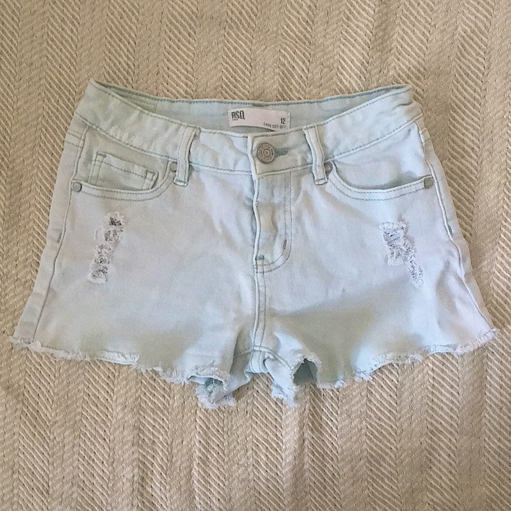 These are cute light blue shorts from RSQ. Lightly worn, a small size 12.
